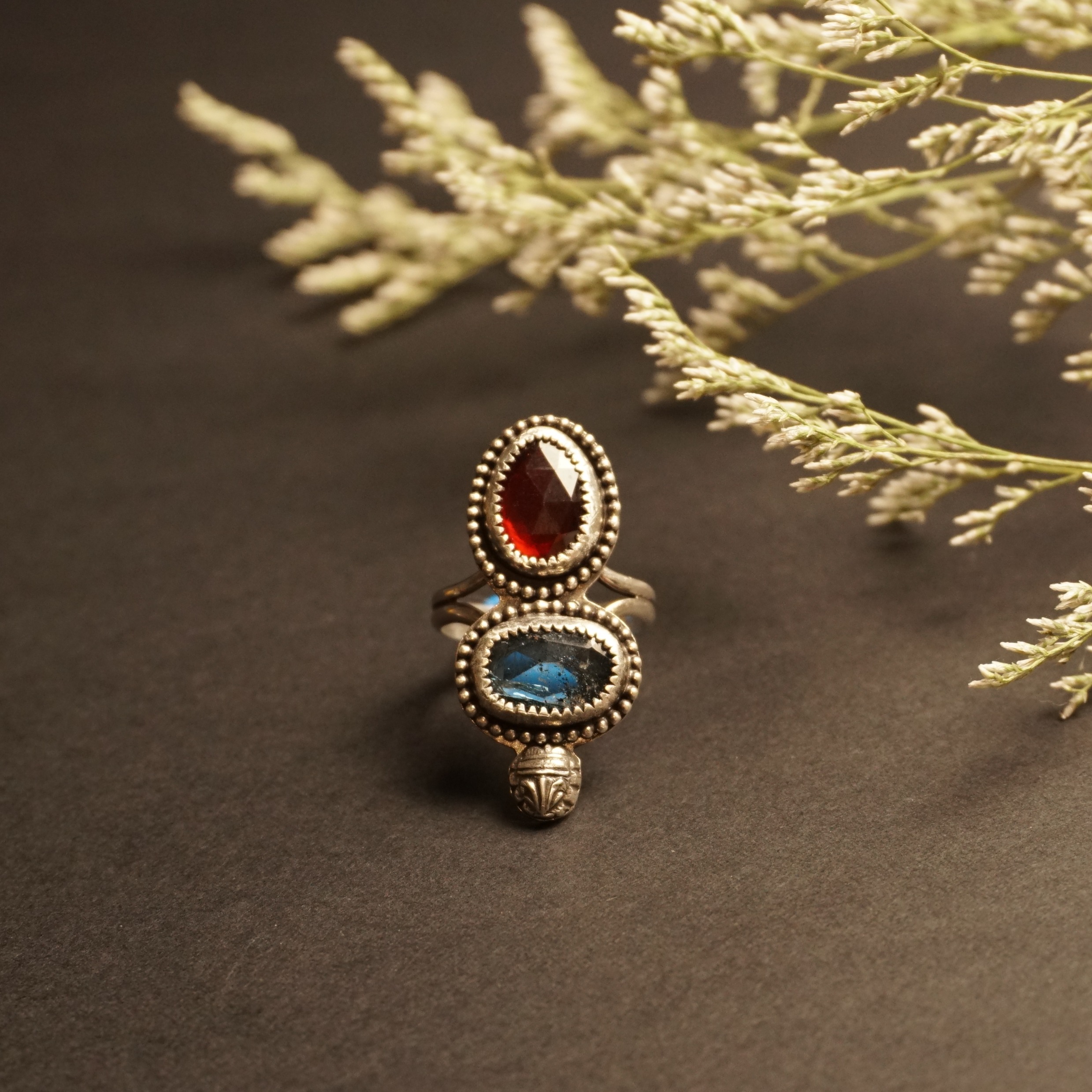 Sterling silver Crown & Embers artisan ring with hessonite garnet and blue kyanite, front view