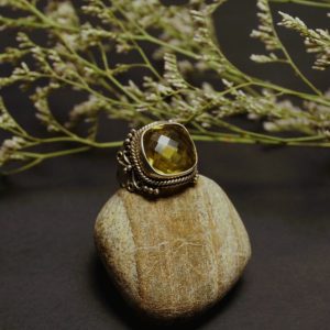 Sterling Silver Lemon Quartz Ring facing right in cool light