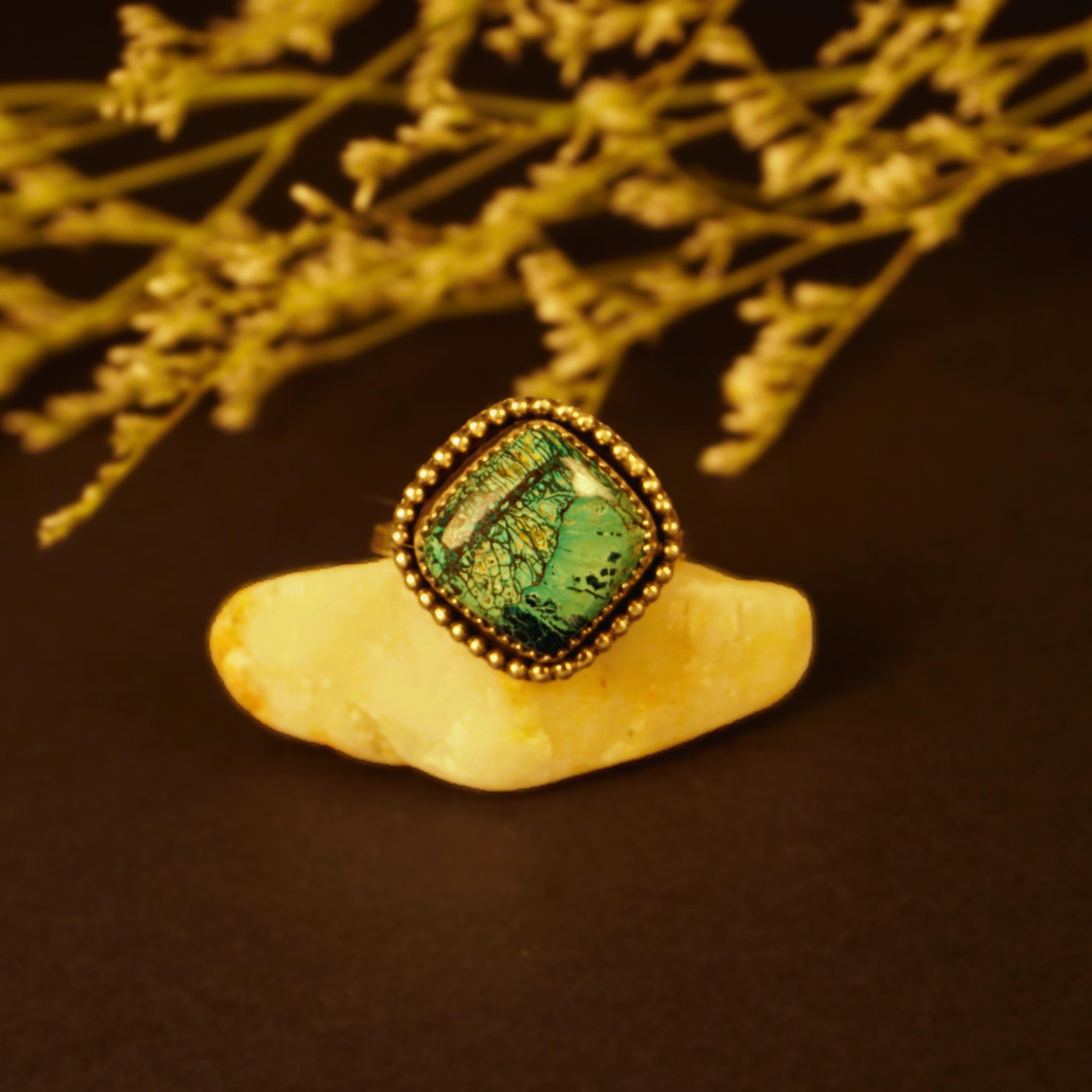 Shattuckite sterling silver ring showing front angle with blue landscape stone