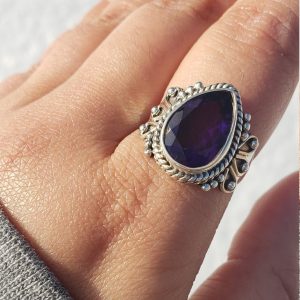 Genuine amethyst ring set in sterling silver with a .925 stamp, featuring a rich purple hue