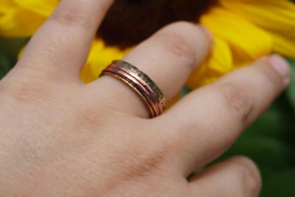 Wearing brass spinner ring on finger