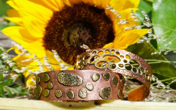 Textured brass and copper open cuff bracelet displayed with sunflower backdrop, 17 cm, ~20 g