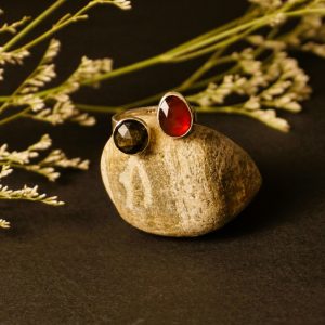 Solar Flare Ring – garnet obsidian silver ring front view, soft light