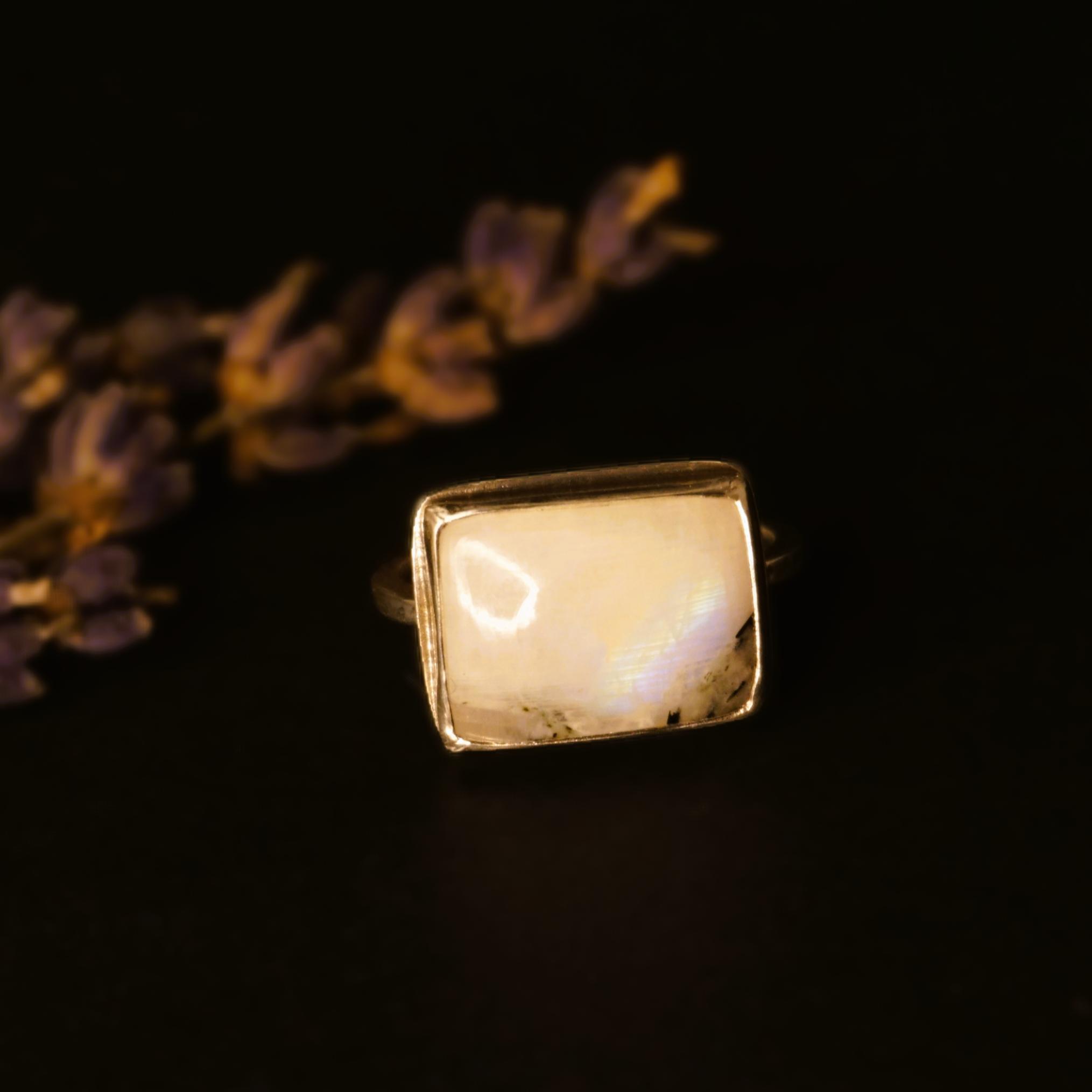 Square moonstone silver ring, tilted view showing sheen